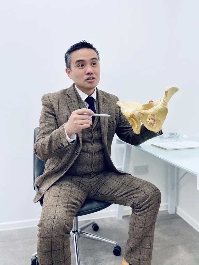 Professor Paul Lee with a pelvis and hip model