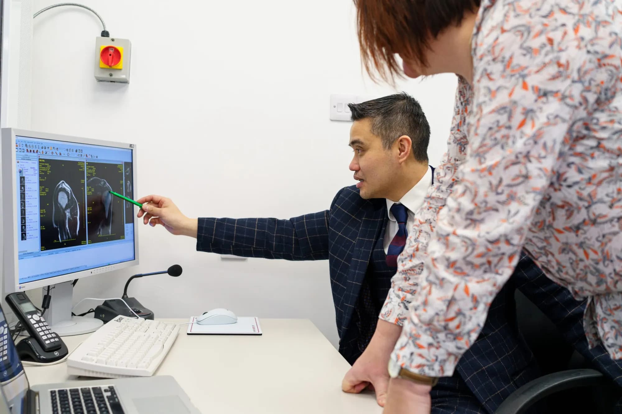 Professor Paul Lee going through an MRI scan in clinic
