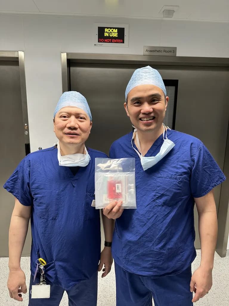 Professor Paul Lee with a surgical colleague in theatre